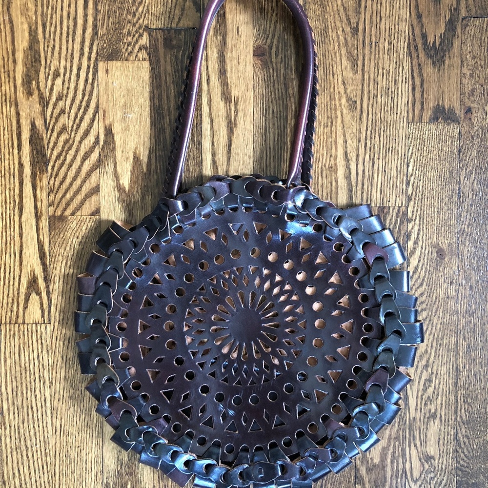 Leather laser cut circular purse bag